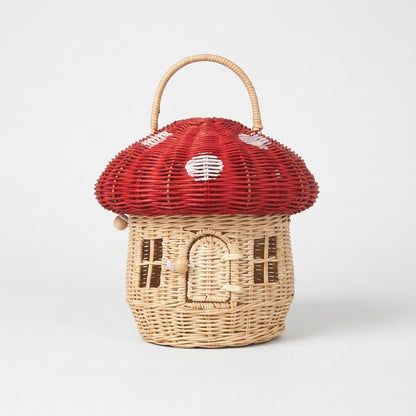 Red mushroom basket product photo with white-spotted cap and house door