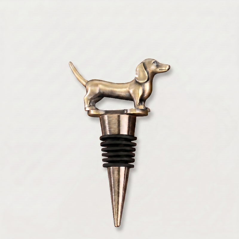 Bronze dachshund dog-shaped bottle stopper on a light gray background