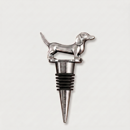 Silver dachshund dog-shaped bottle stopper on a light gray background