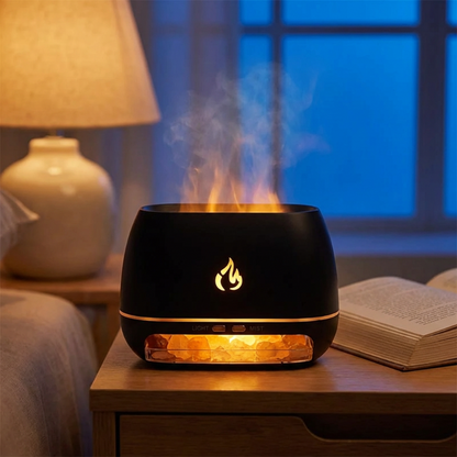 Black flame-shaped diffuser on a table with a warm glow, surrounded by a cozy room setting.