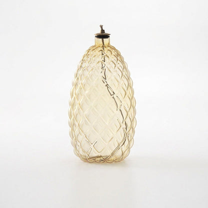 Pinecone glass oil lamp product photo on a white background