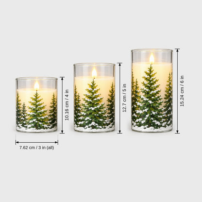 Dimensions graphic of three flameless candles printed with snowy pine trees, heights 10.16 cm or 4 in, 12.7 cm or 5 in and 15.24 cm or 6 in, each 7.62 cm or 3 in wide