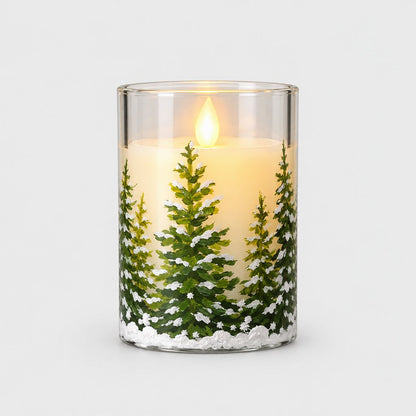 Small flameless candle printed with a snowy pine tree and a glowing flame on a plain light background