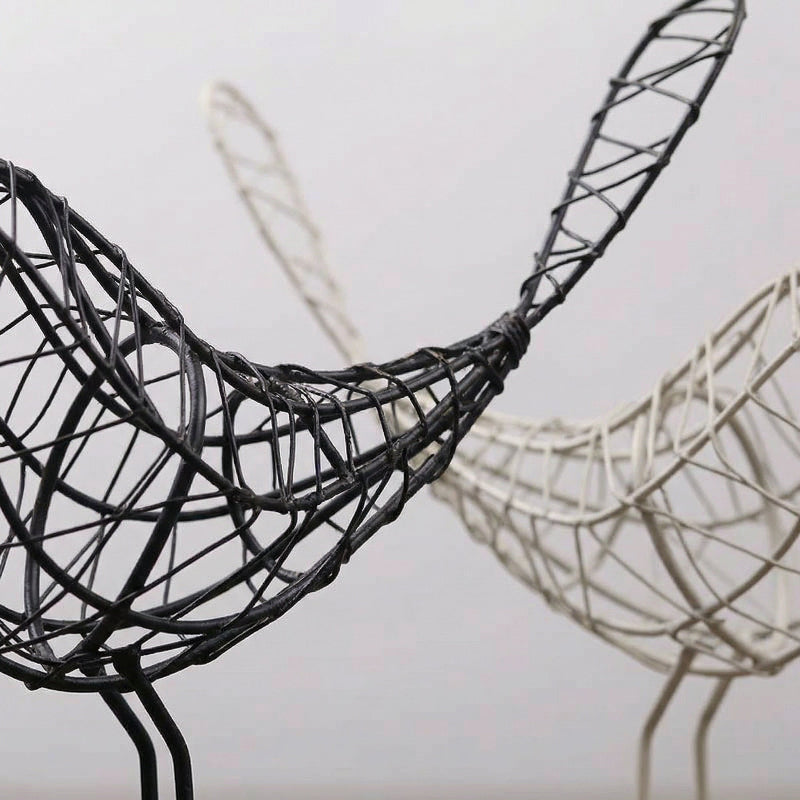 Close-up of iron bird sculpture wire detail