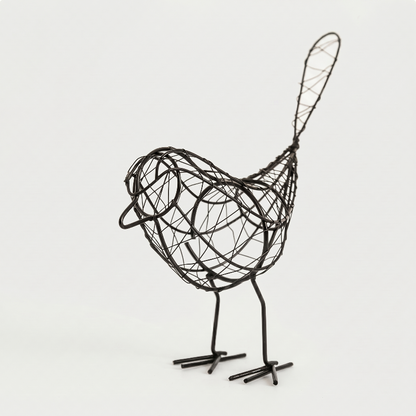 Iron bird sculpture on white background facing right