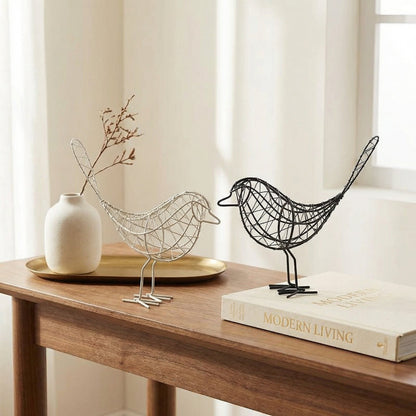 Iron bird sculpture on console table in bright interior