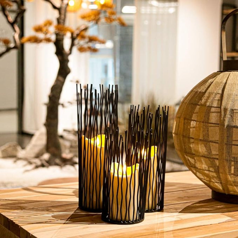 Industrial-inspired iron candle stands, designed to add an edgy, rustic flair to your home or office.