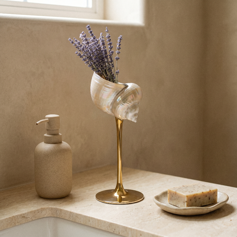 Isla seashell glass with lavender stems on bathroom counter