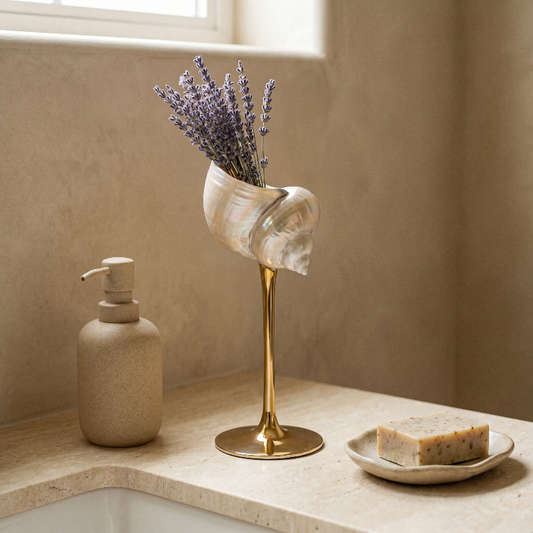 Isla seashell glass with lavender stems on bathroom counter