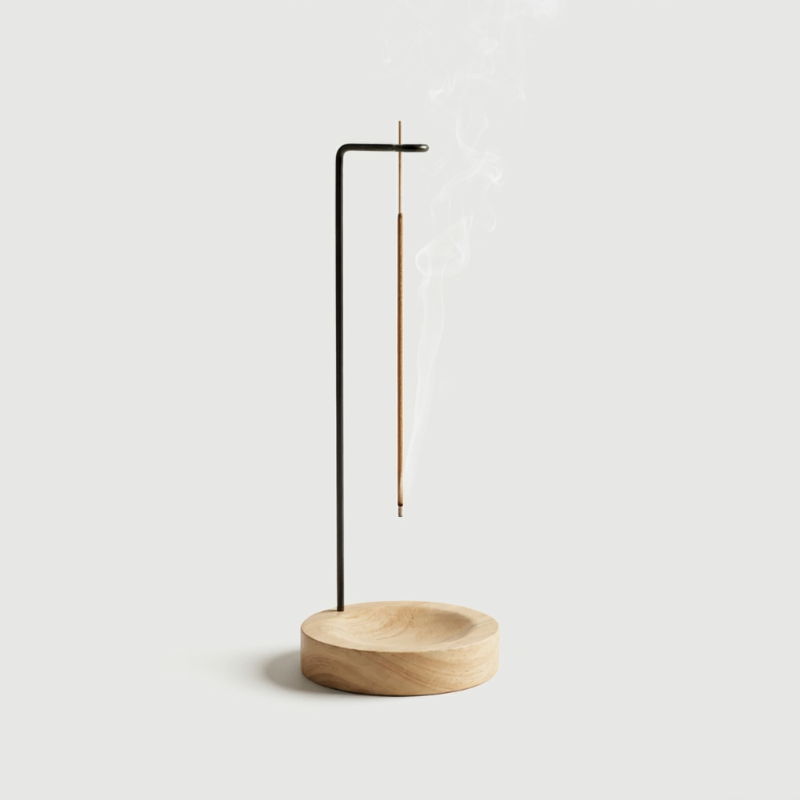 Kanso suspended oak wood incense burner with white background.