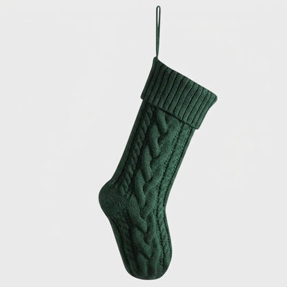 Green knit Christmas stocking product photo on a white background