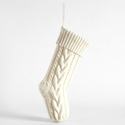White knit Christmas stocking product photo on a white background