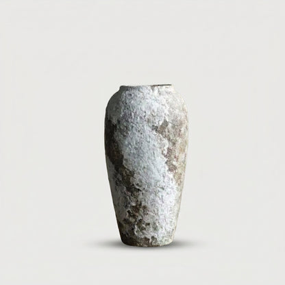 Slim ceramic rustic circular vase on white background