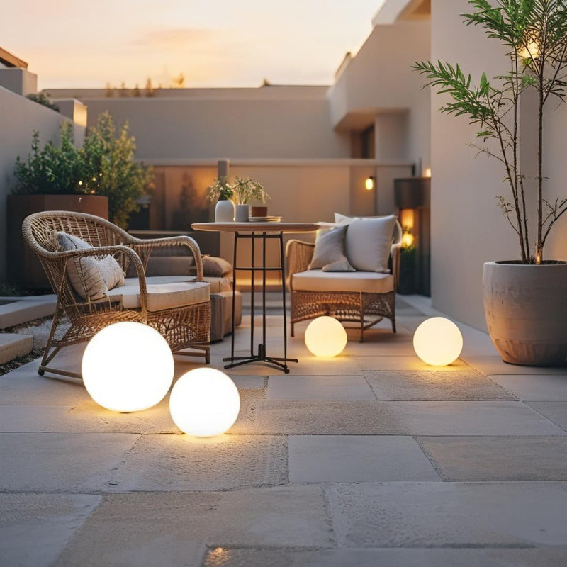 LED garden ball lights on patio beside staircase at night