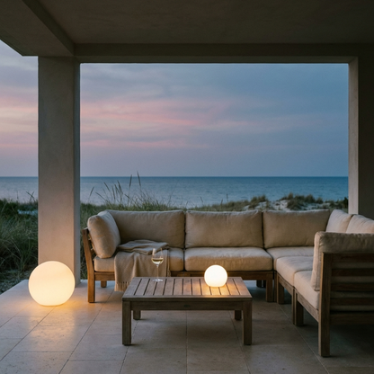 LED garden ball lights glowing on covered patio at dusk