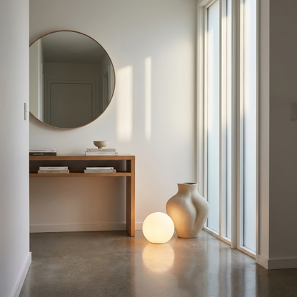 LED garden ball lights on floor by window in bright living room