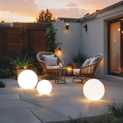 LED garden ball lights on patio dining area at sunset