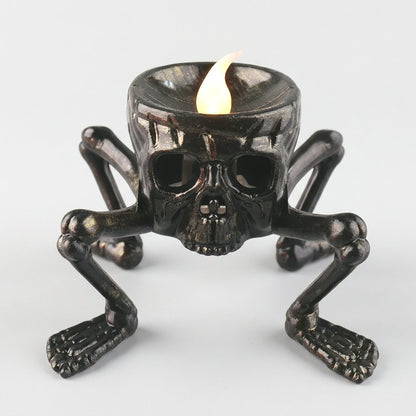 Lit Skull LED Halloween candle product photo on a white background