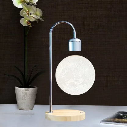 Levitating moon lamp with wireless charging, ideal for creating a serene atmosphere while keeping your devices powered up.