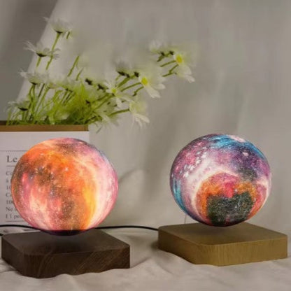 User adjusting the Levitating Starry Sky Lamp with a remote control to change its colors and brightness.