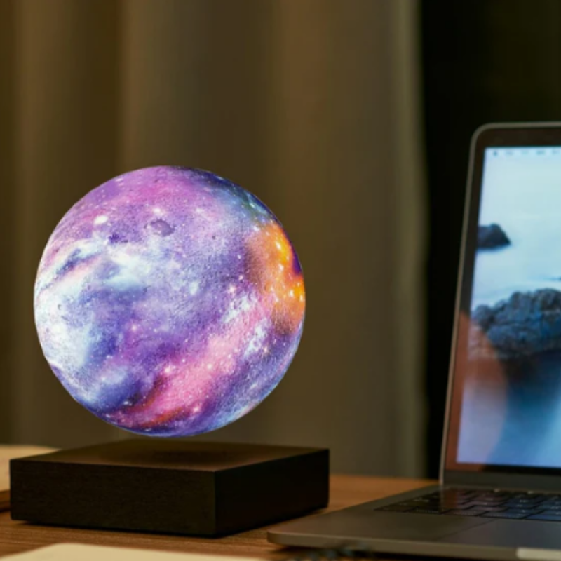 Compact and stylish Levitating Starry Sky Lamp placed on a small table, demonstrating its sleek and modern design.