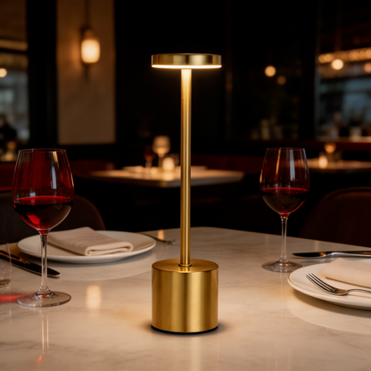 Luca touch table lamp in gold on dining table at night