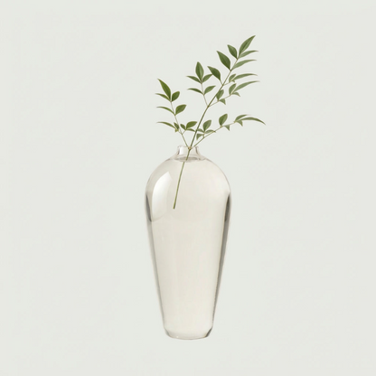 Lucia hand-blown clear glass vase on white background with eucalyptus stem