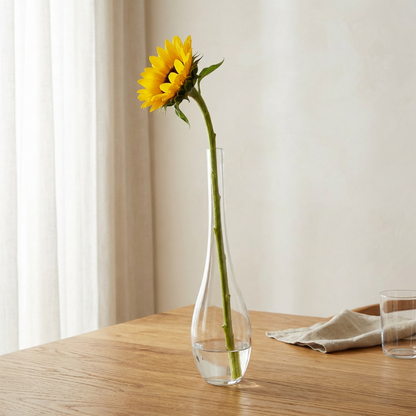 Lucia hand-blown clear glass vase with sunflower on wooden table