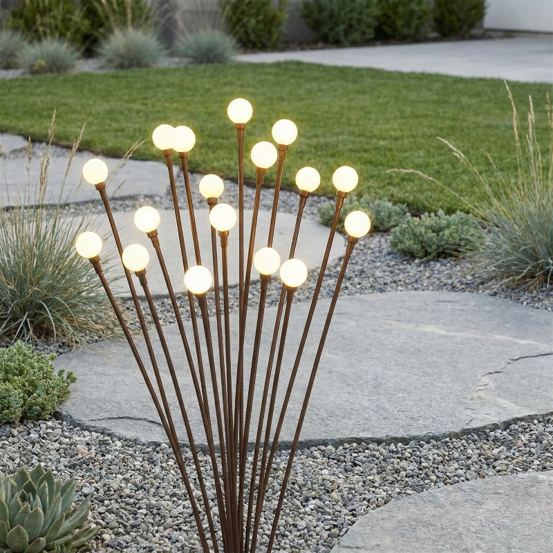 Decorative outdoor light fixture with multiple bulbs on a garden path.