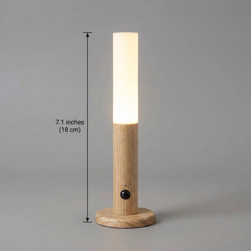Wooden lamp with a light bulb inside, showing dimensions on a gray background
