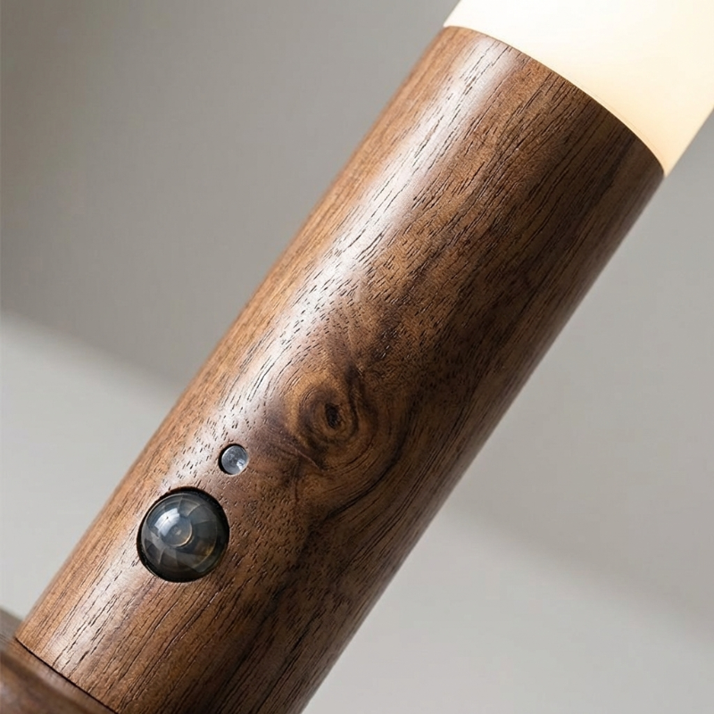 Wooden lamp with a light bulb on a neutral background