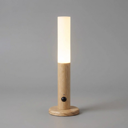 Wooden lamp with a cylindrical shade on a gray background