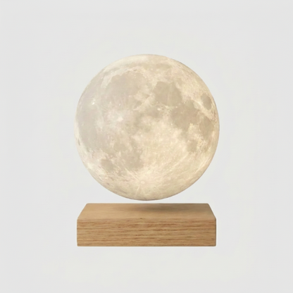 Luna floating moon lamp on light wood base on white background