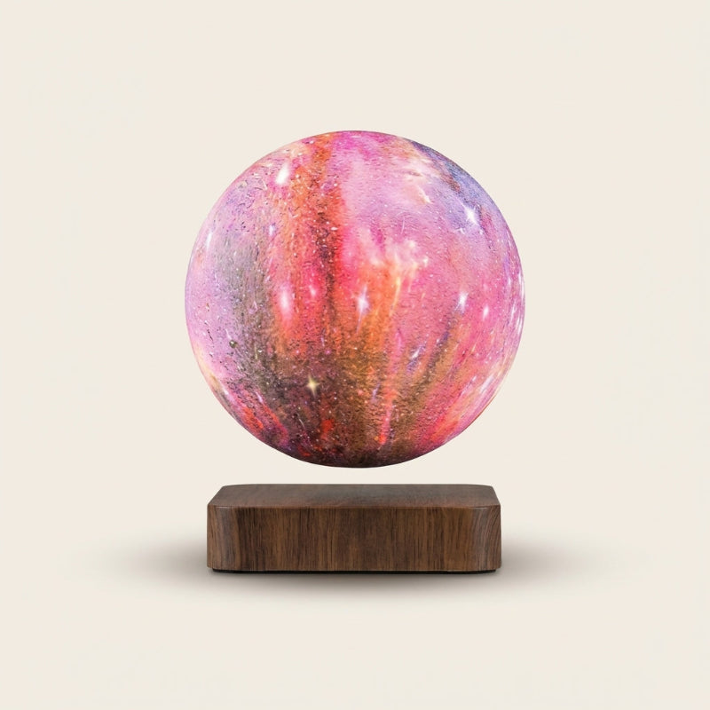 Pink moon lamp on a wooden base against a beige background