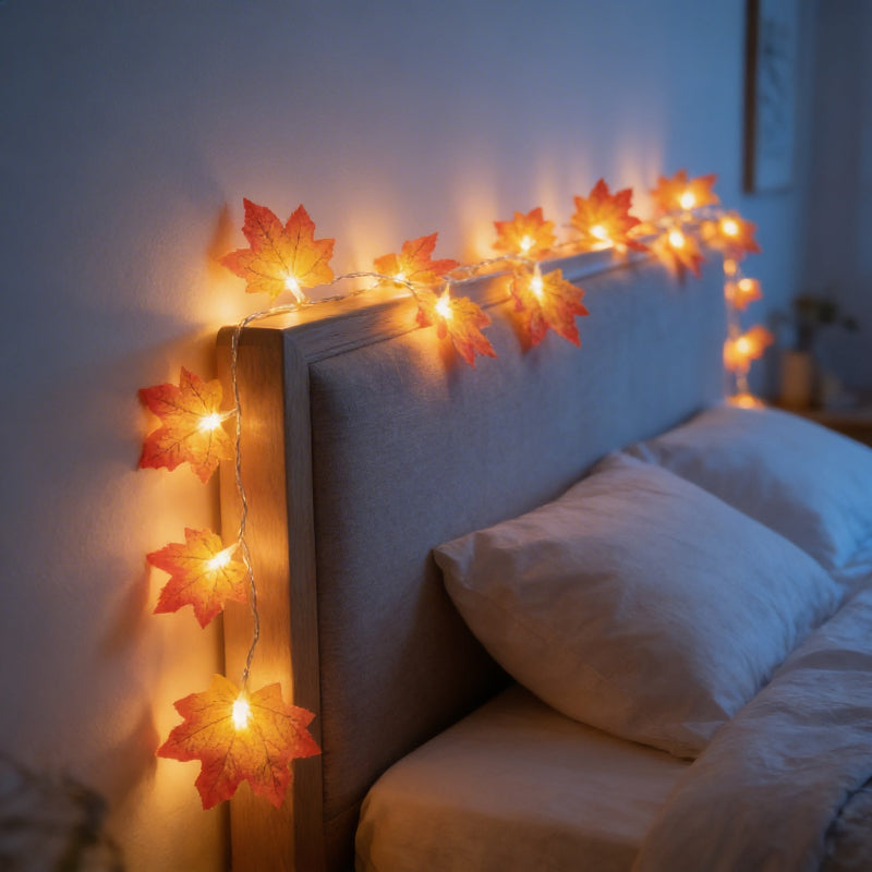 Maple leaf string lights draped along bed