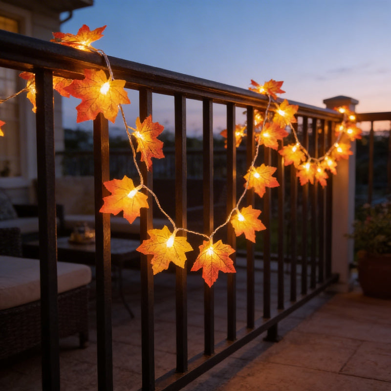 Maple leaf string lights on garden railing