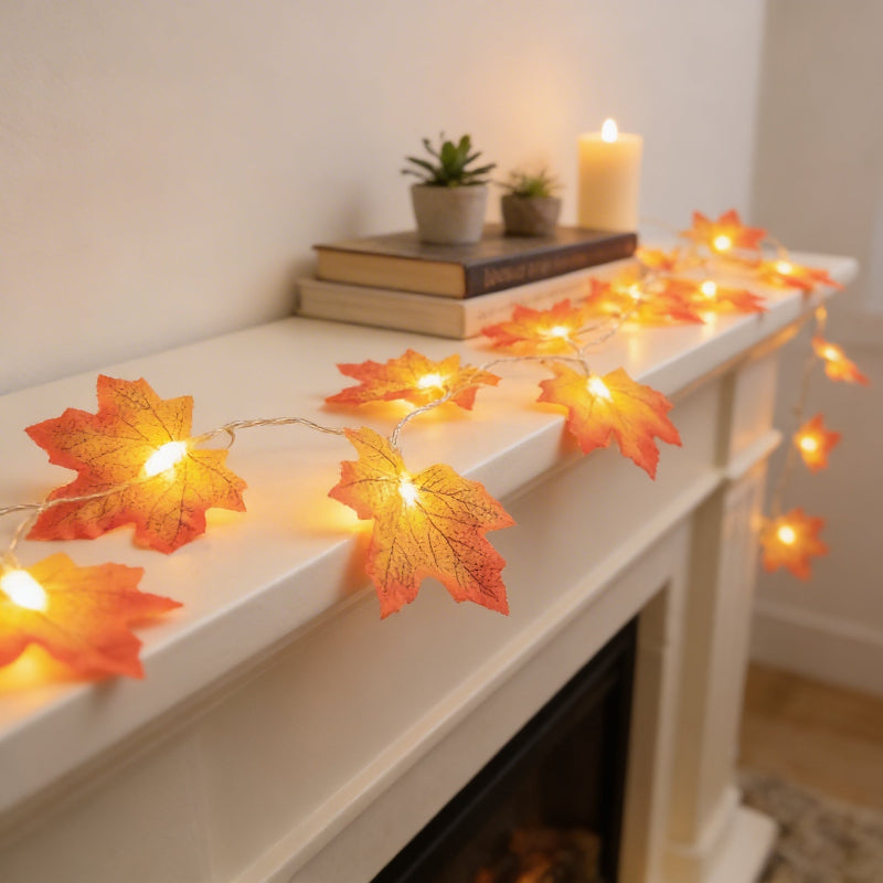 Maple leaf string lights draped along mantel