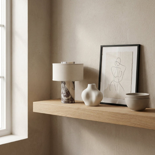 Wooden shelf with decorative items against a beige wall