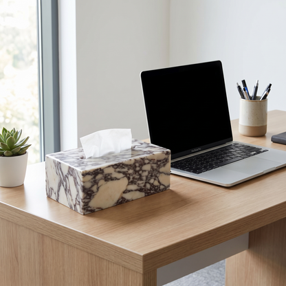 Calacatta marble tissue box cover on a desk beside a laptop
