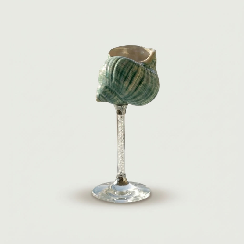 Blue Maris seashell glass on white background