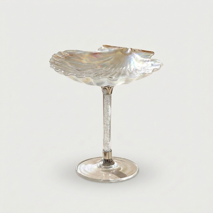 Cream Maris seashell glass on white background