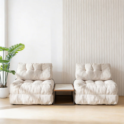 Two white cushioned chairs with a small table between them in a minimalistic room.