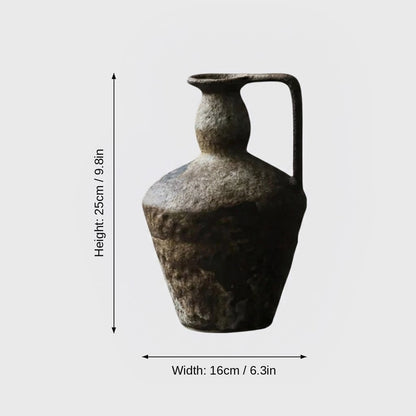 Dimensions graphic of a dark brown-gray single-handled ceramic pitcher vase labeled Height 25cm / 9.8in and Width 16cm / 6.3in