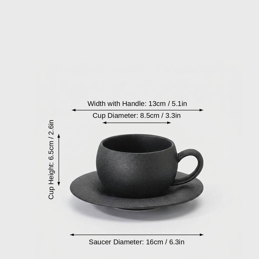 Dimensions graphic of a matte black ceramic cup and saucer labeled Width with Handle 13cm / 5.1in, Cup Diameter 8.5cm / 3.3in, Cup Height 6.5cm / 2.6in and Saucer Diameter 16cm / 6.3in