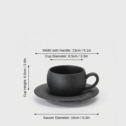 Dimensions graphic of a matte black ceramic cup and saucer labeled Width with Handle 13cm / 5.1in, Cup Diameter 8.5cm / 3.3in, Cup Height 6.5cm / 2.6in and Saucer Diameter 16cm / 6.3in