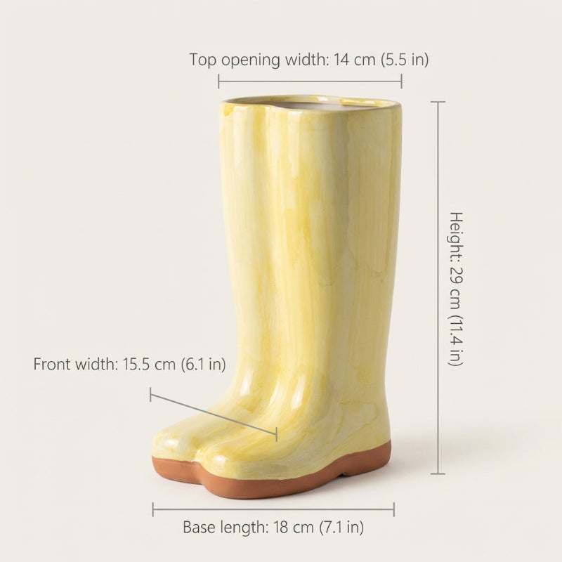 Yellow rain boot with measurements on a white background
