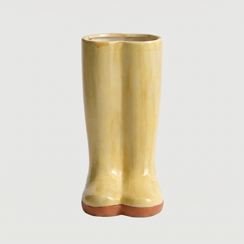 Yellow Meadow boot vase on white background