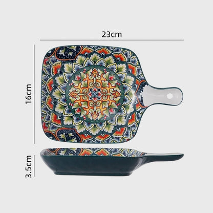 Patterned ceramic square pan with a long flat handle shown from above and the side, labeled 23cm long with the handle, 16cm wide and 3.5cm high