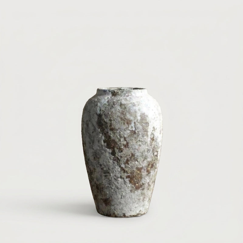 Tall ceramic rustic circular vase on white background
