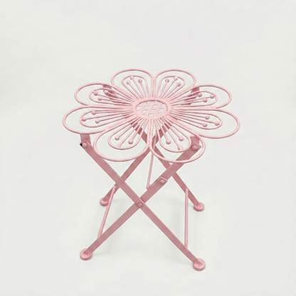 Metal flower bistro table in pink on white background
